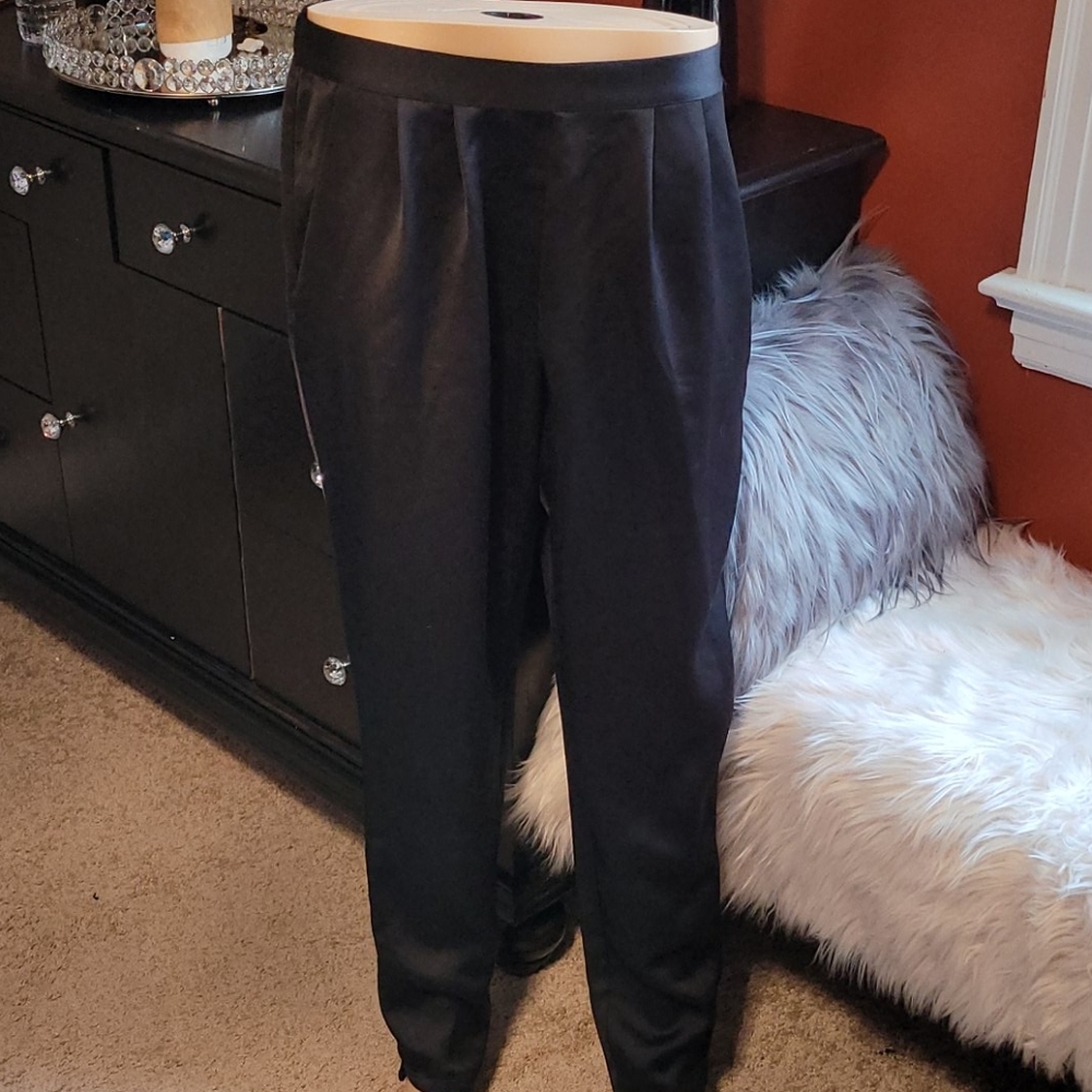 Black silky pants with pleated front and pockets